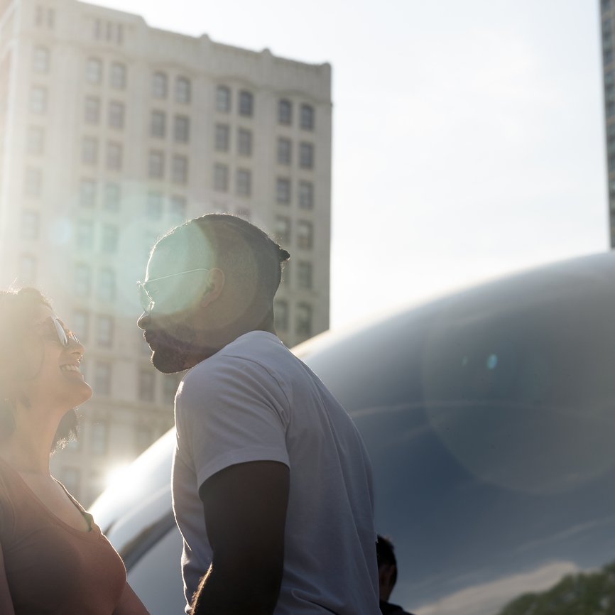 a couple in front of chicago bean