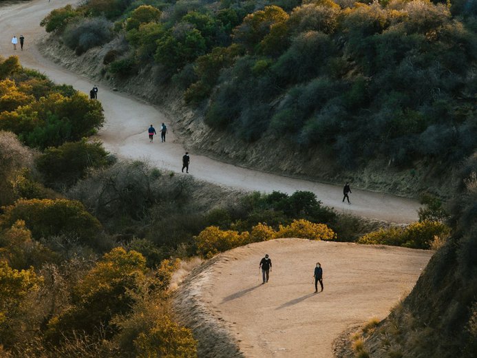 Hikers in Griffith Park close to Los Angeles at golden hour