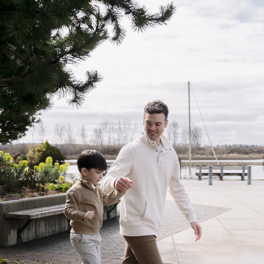 dad and son are exploring steveston village located closed to downtown
