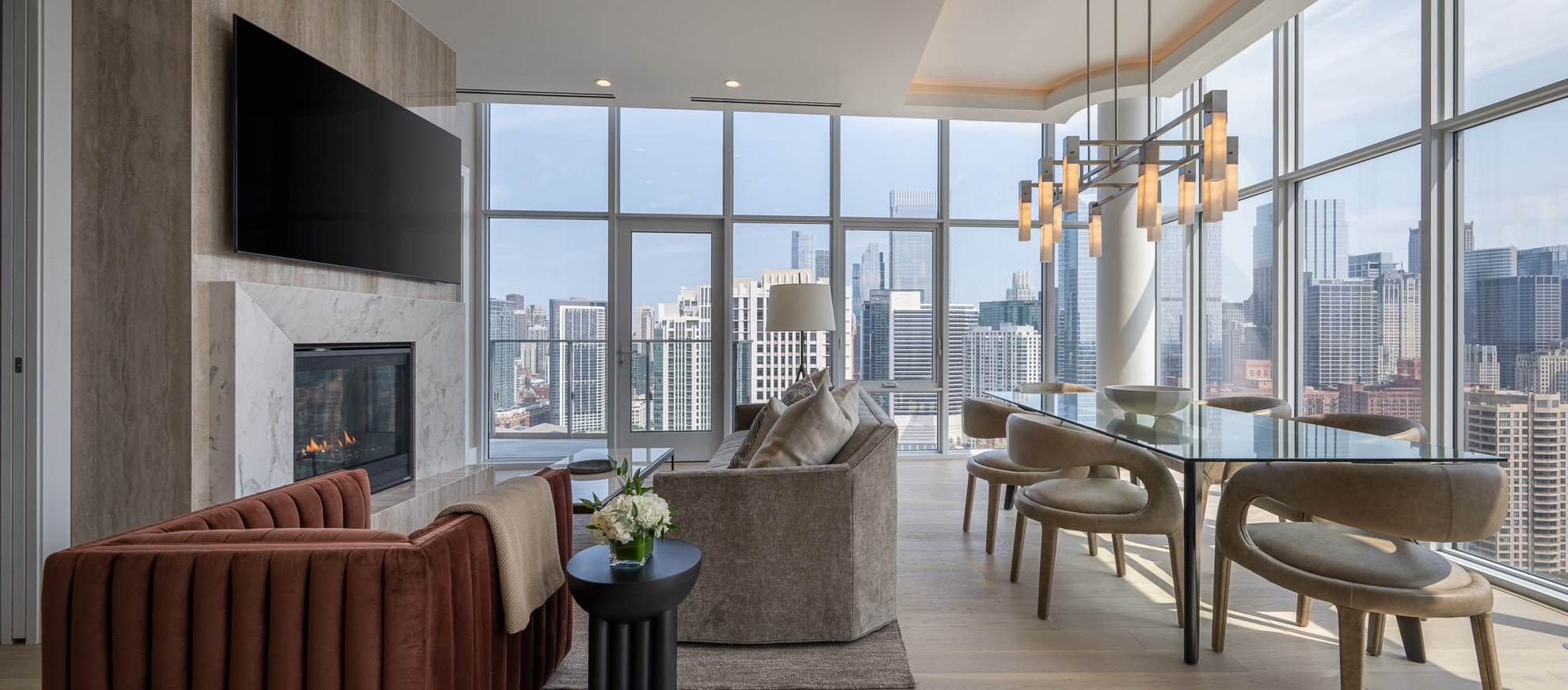 living area with modern furniture and beautiful view of chicago skyline at the penthouse level chicago fulton market