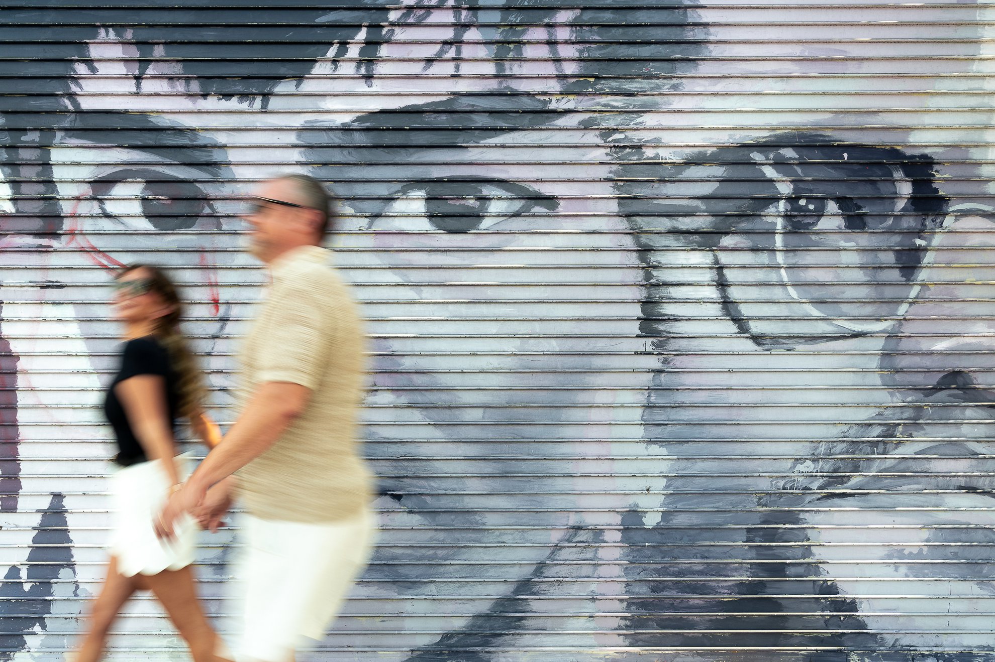 couple walking through downtown los angeles arts district