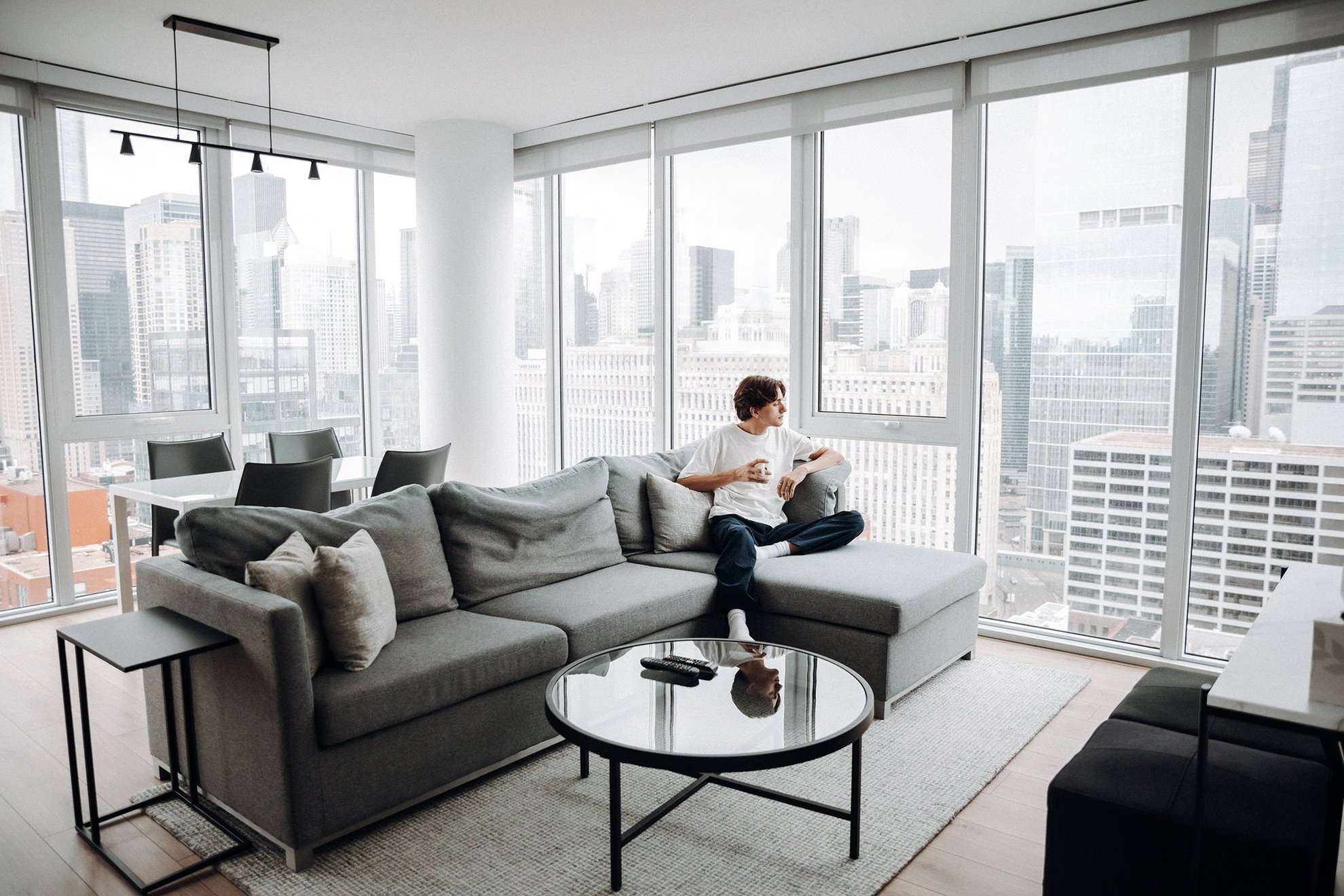 a man sipping the coffee with beautiful chicago city view at level chicago river north