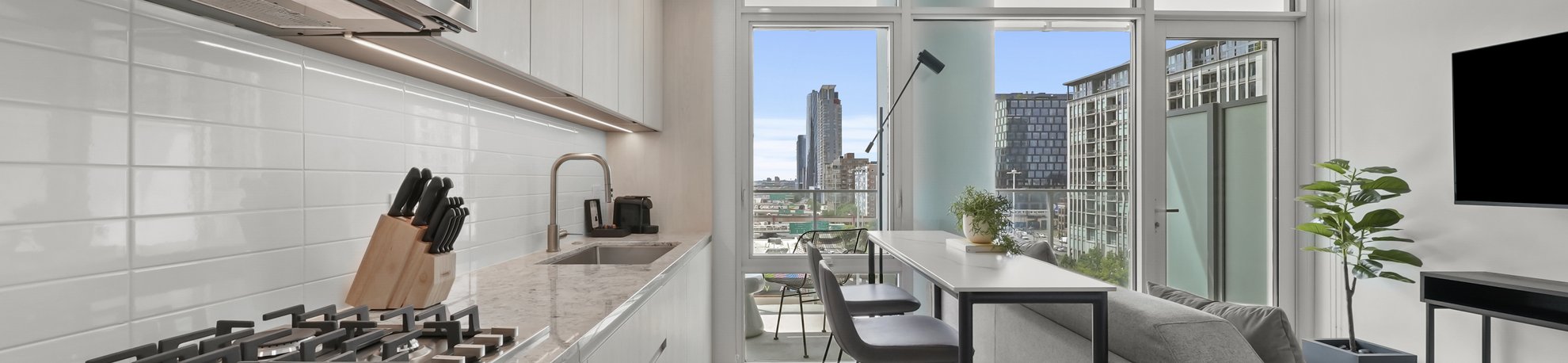 open concept studio featuring kitchen and living area at level chicago fulton market