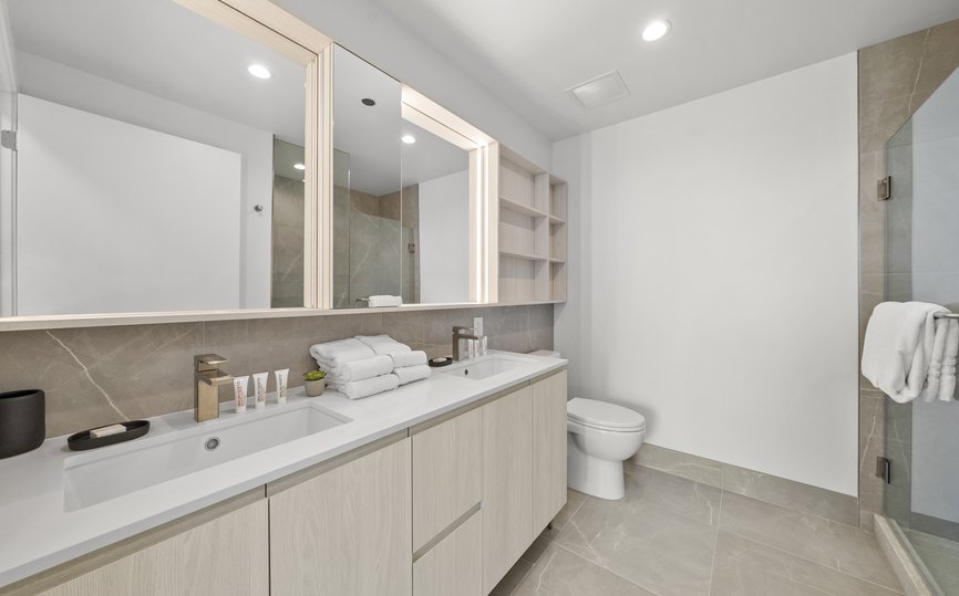 modern luxury bathroom features standing shower, cabinet as well as malin goetz bathroom amenity at level chicago fulton market
