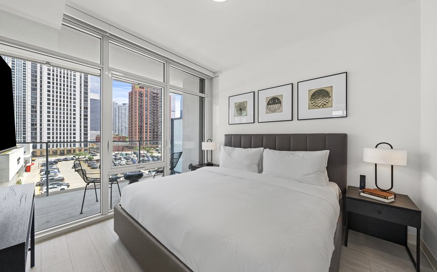 two bedroom suite features bedroom with open balcony at level chicago fulton market